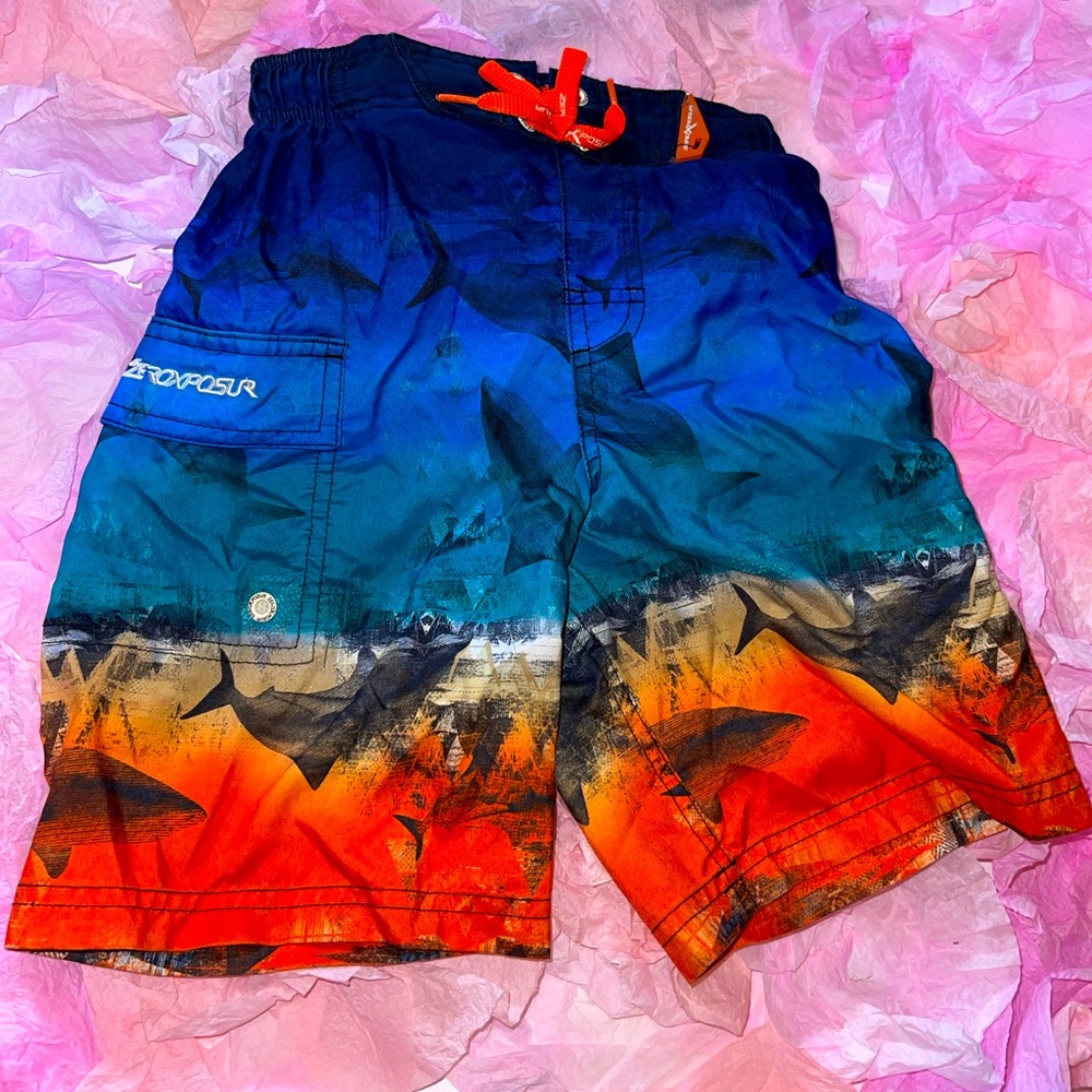 Kids medium 5-6 swim trunks. Blue to orange shark design